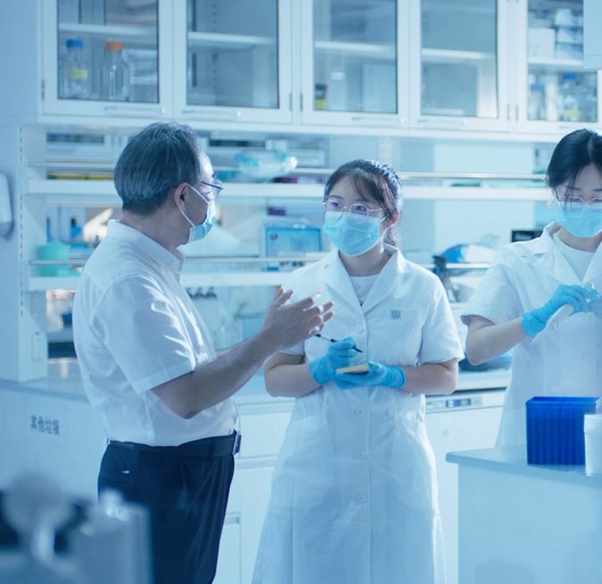 Scientists discussing results in the laboratory